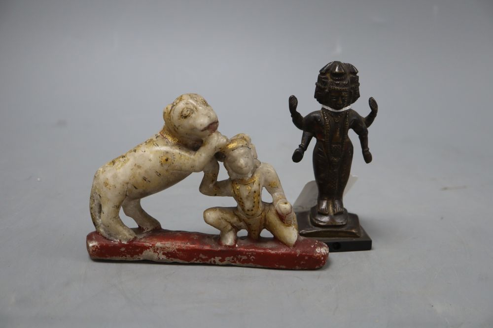 An Indian painted marble group and an Indian bronze of a deity